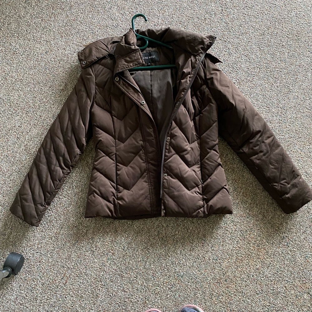 Brown coat. Fur trim hood. Perfect condition